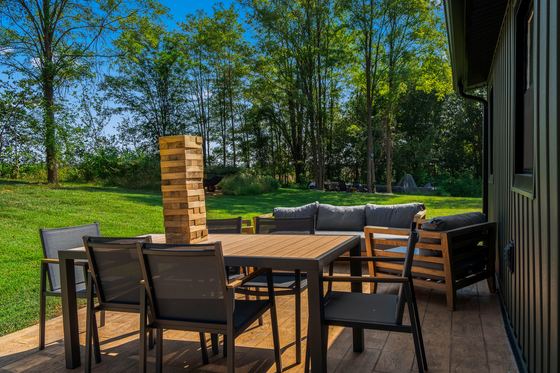 Outdoor dining table and lounge seating on the patio.